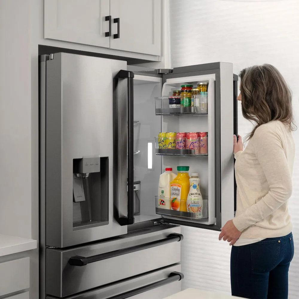 ZLINE Autograph Edition 36-inch refrigerator in fingerprint-resistant stainless steel with bright white interior and matte black accents RFMZ-W-36-MB, door open